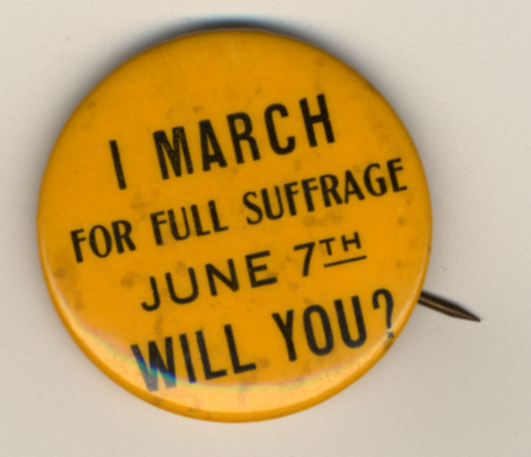 Photograph of a political button reading, "I march for full suffrage June 7th. Will you?" From the SCUA Artifact Collection. Suffragists wore buttons like this for a variety of reasons. Many to get people to know that suffrage was on the ballot or to proudly show that they were a suffragist.