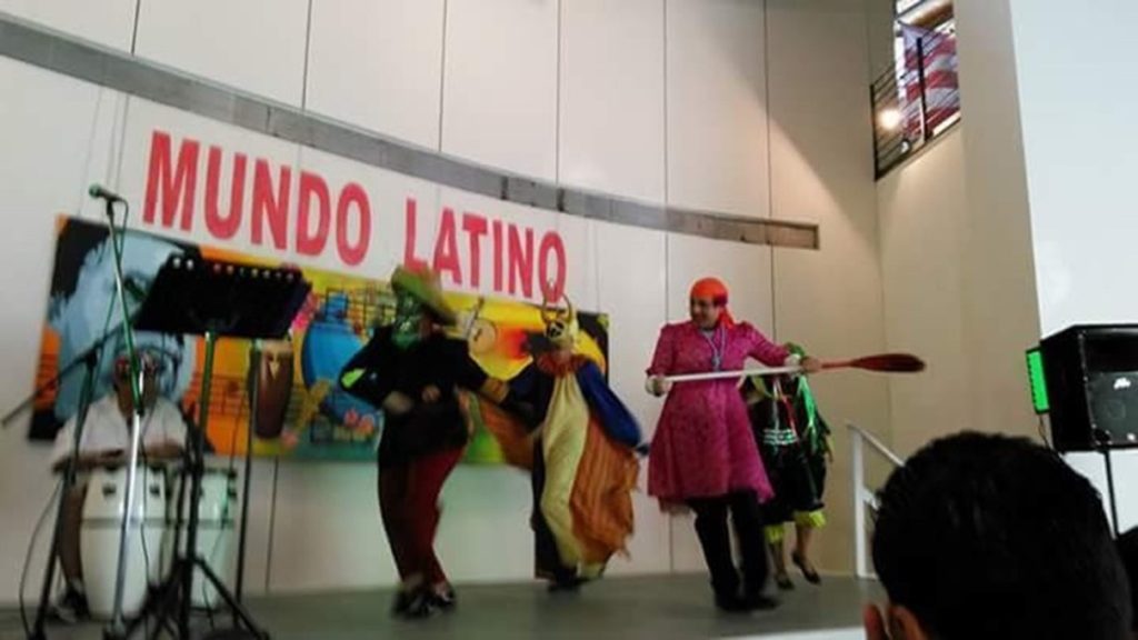 People on a stage dressed up as characters for a festival.