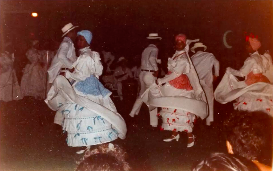 Three dance partners performing Bomba