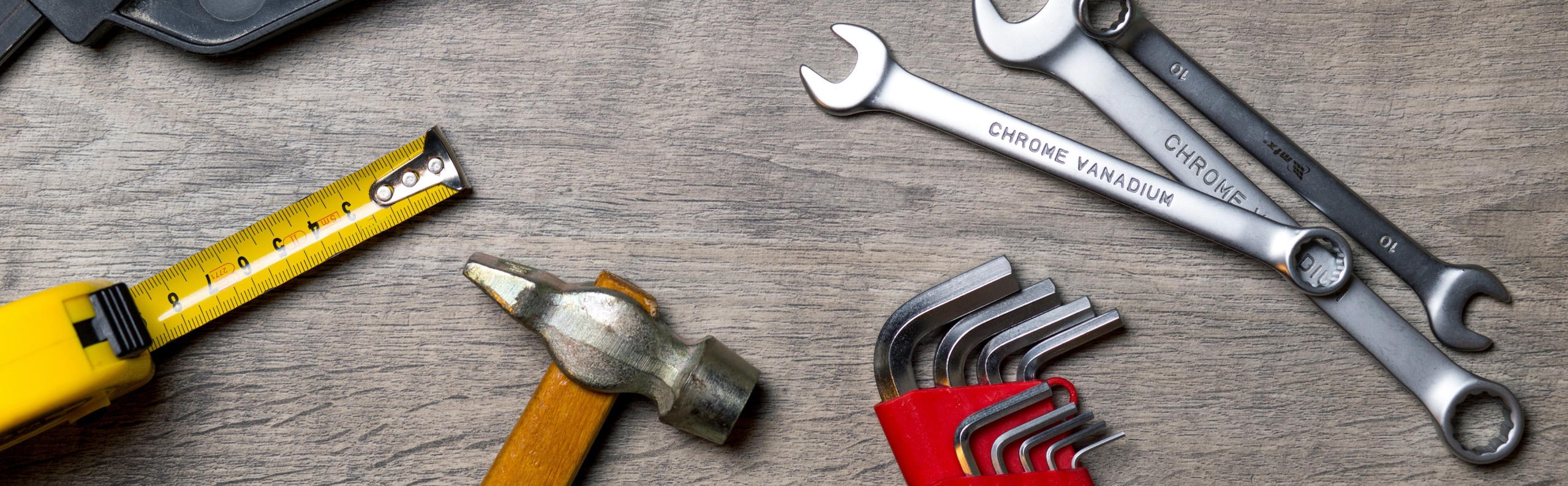 A variety of tools on a work surface.