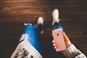 photo showing a girl holding a cell phone