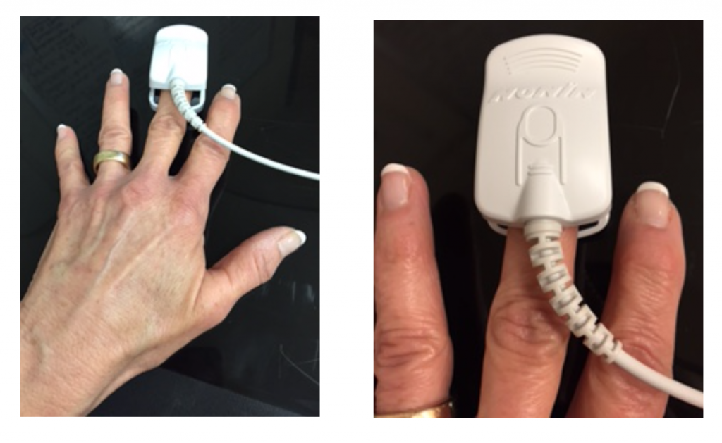 The pulse oximeter is worn over the middle finger's top knuckle and tip