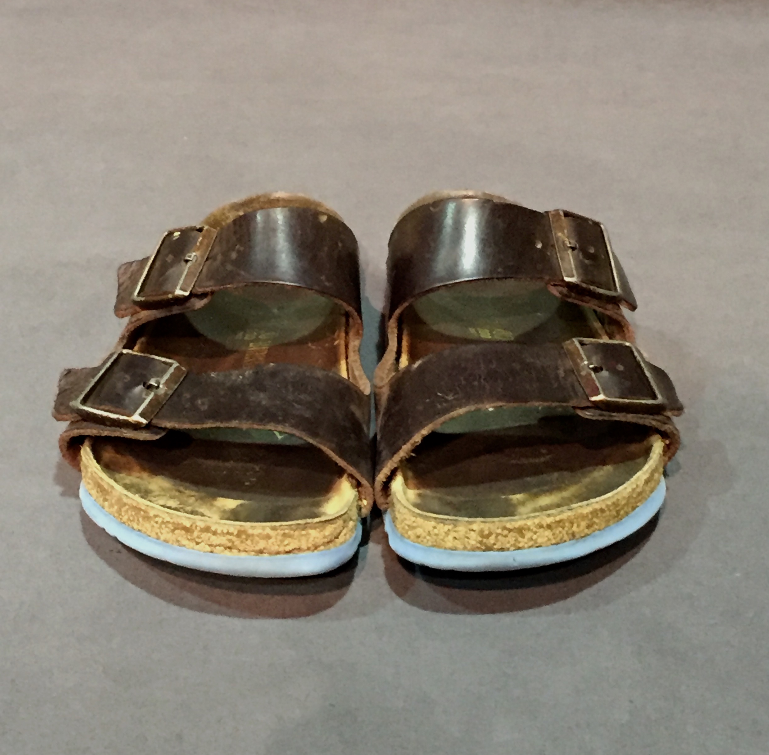 Dark brown Birkenstock sandals.