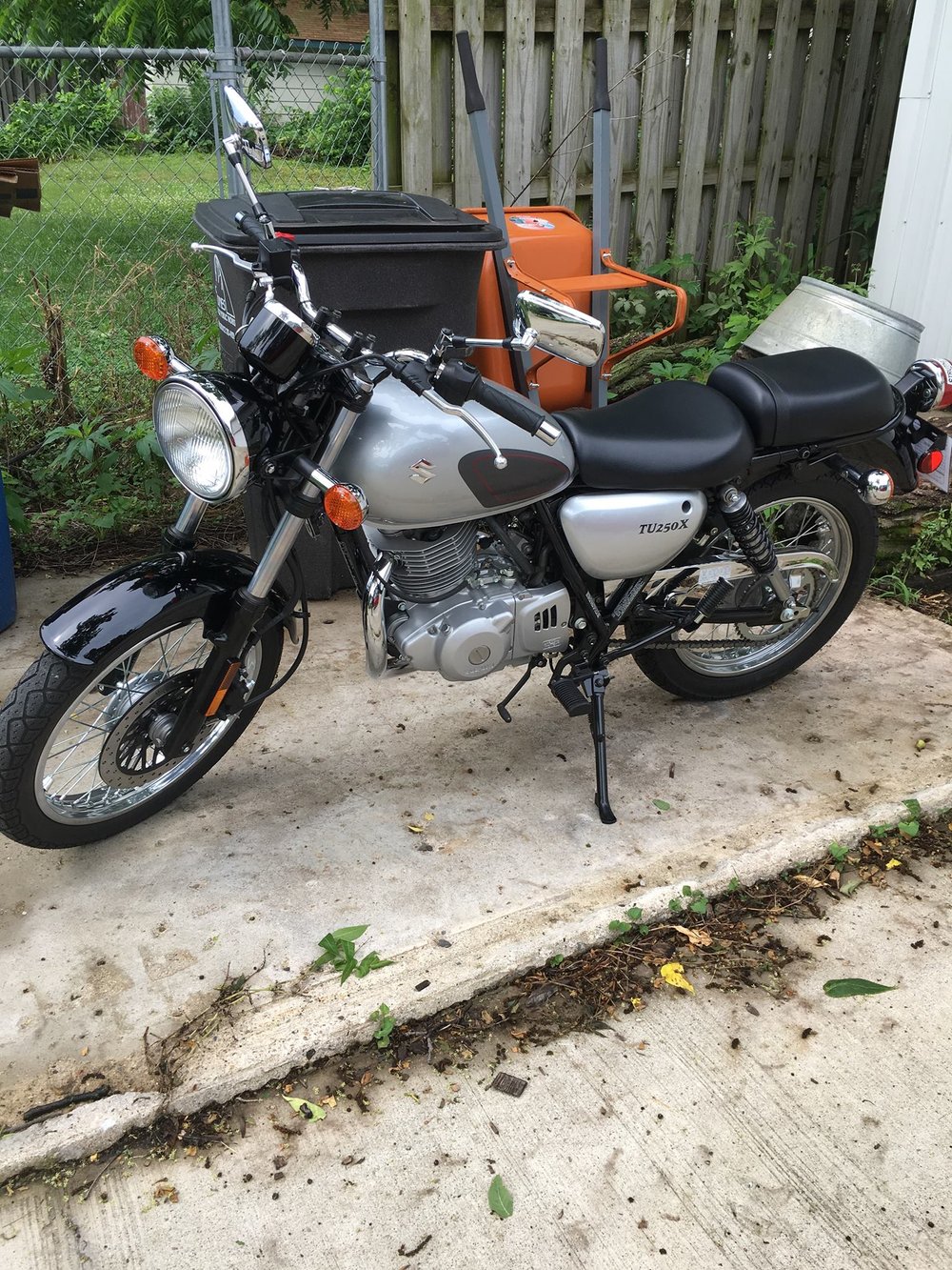 Photograph of black and silver Suzuki motorcyle