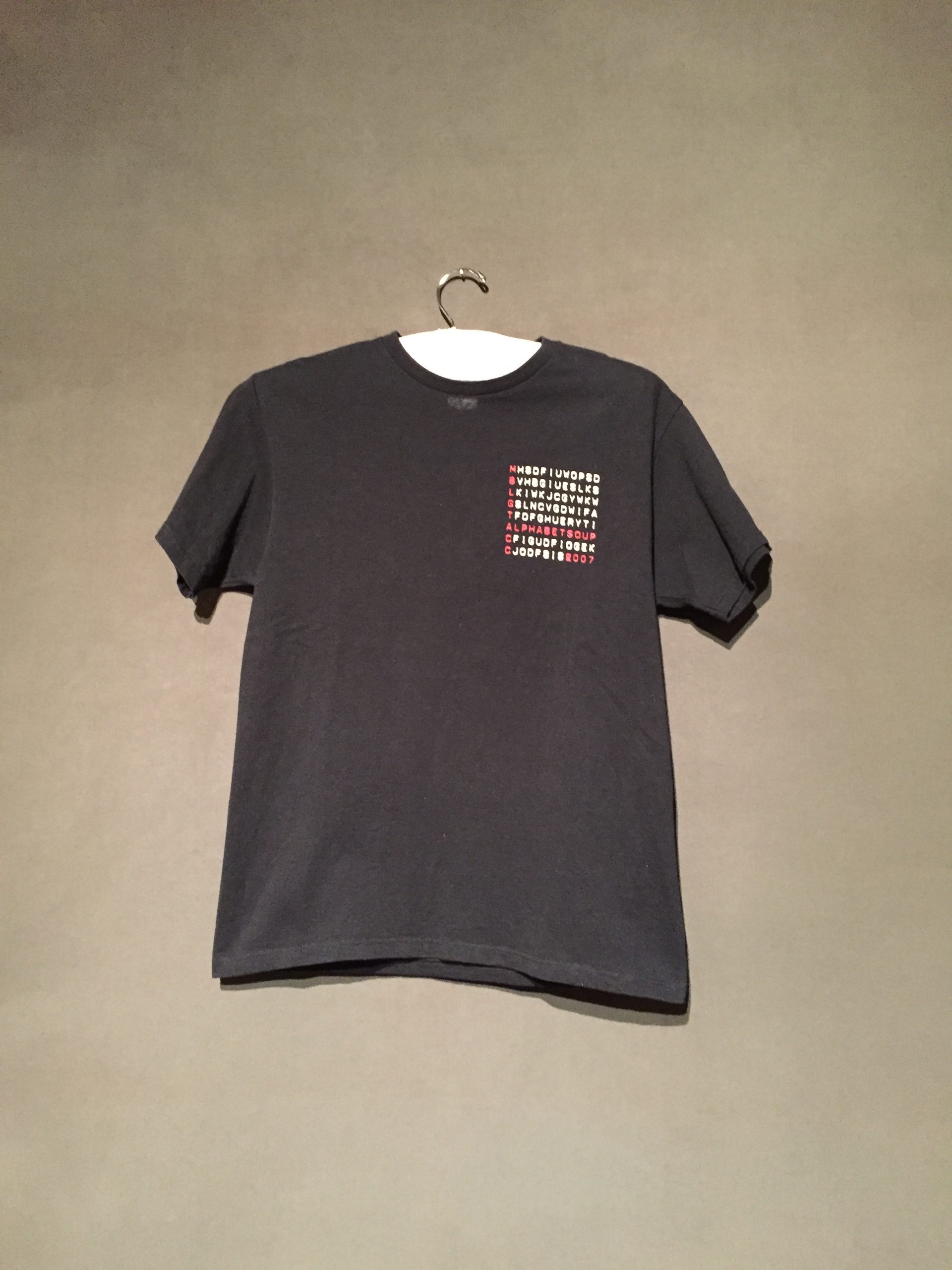 Black short sleeve t-shirt with red and white text reading: "MBLGTACC Alphabet Soup 2007"