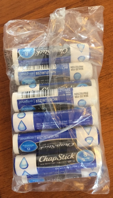 Plastic baggie of several blue Chap Stick lip balm sticks