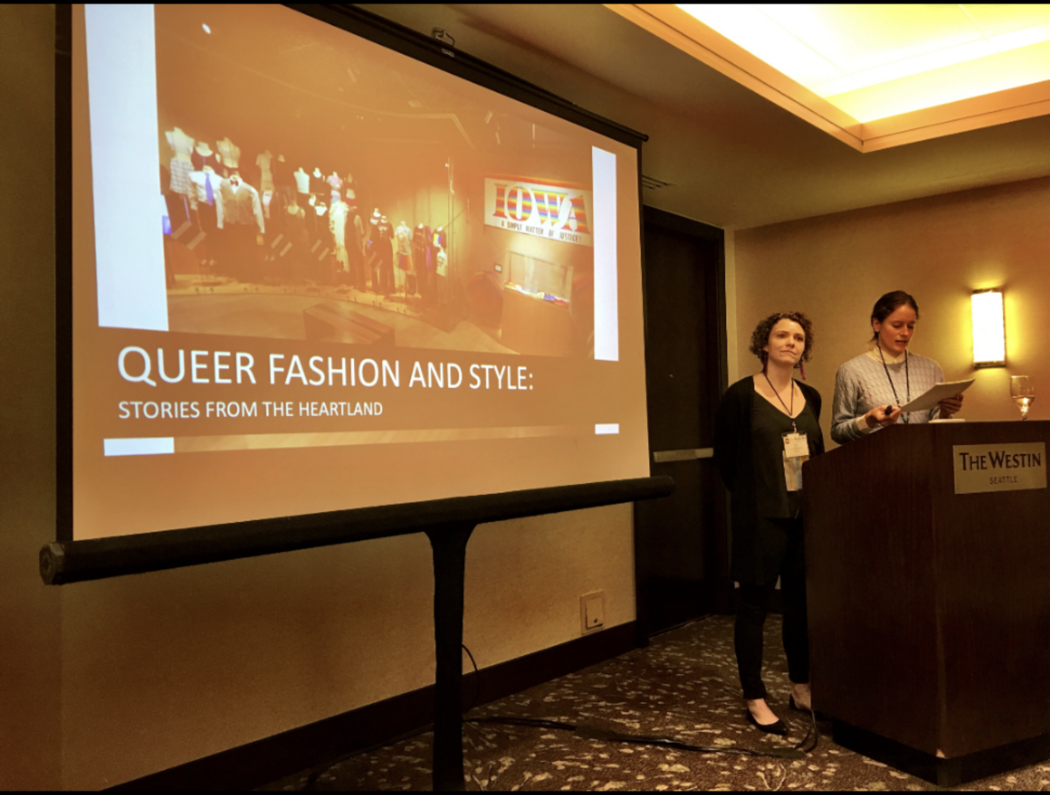 Kelly Reddy-Best (left) and Dana Goodin (right) presenting the paper titled Queer Fashion and Styles: Stories from the Heartland - A Museum Exhibition at the Costume Society of America national conference in 2019 in Seattle, Washington