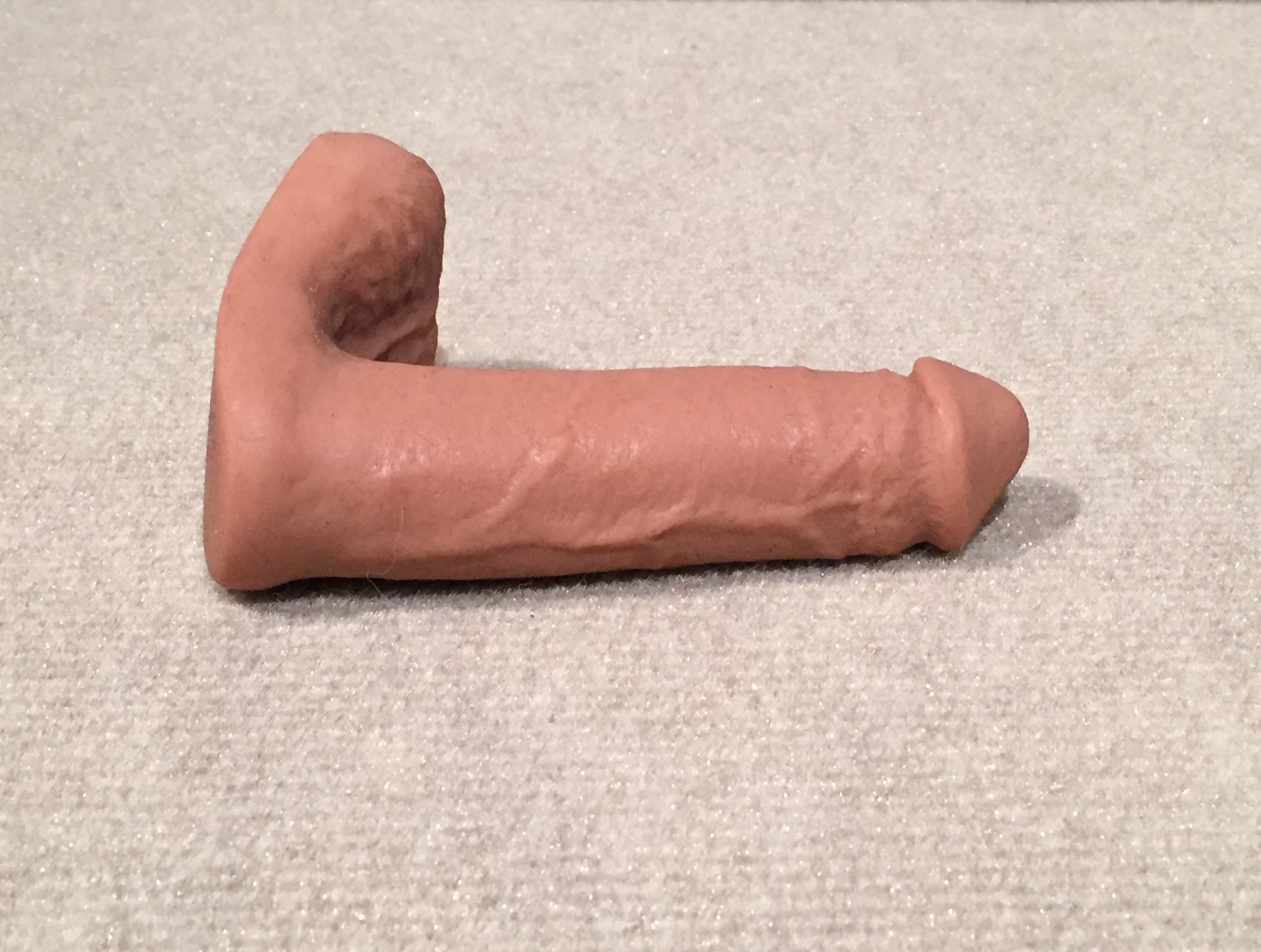 Realistic-looking silicone packer with light-medium skin tone