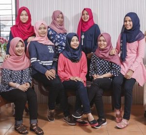 Group of young women in colorful hijab.