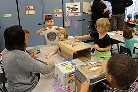 Photo of children in preschool working on a group project.