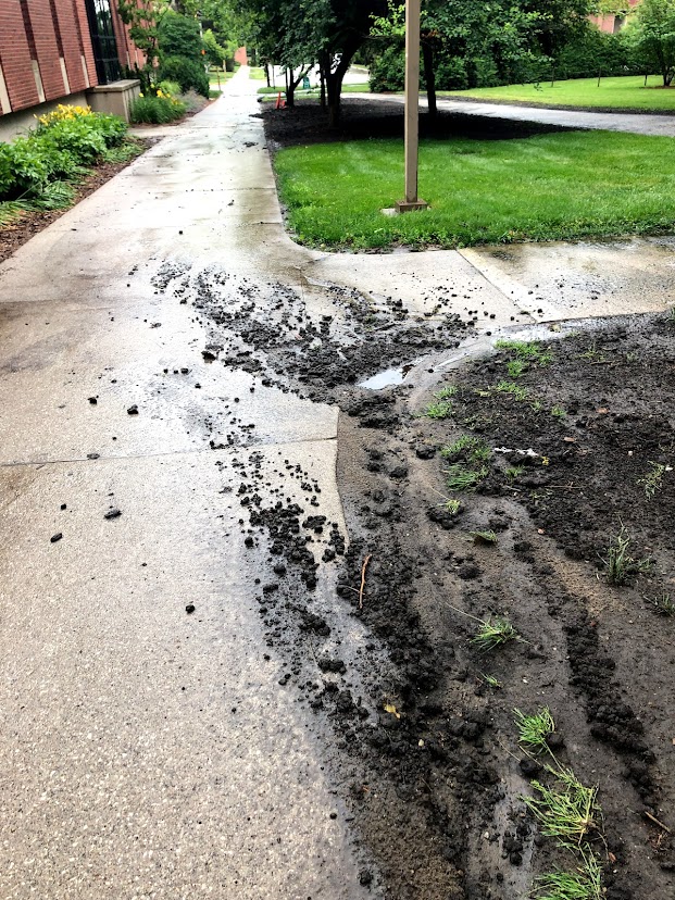 Soil sediment washed onto a sidewalk
