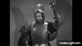 A cream pie flies through the air and hits Larry in the face