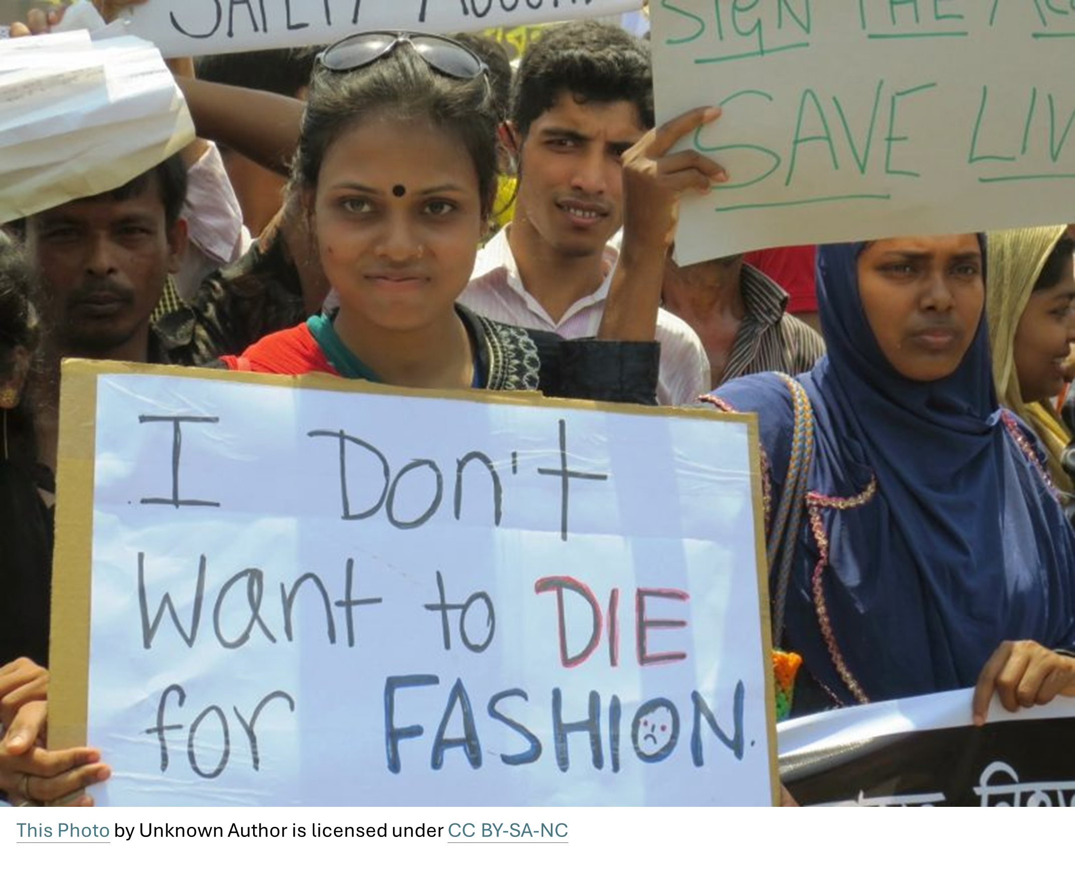 Protesters with a sign that reads: I don't want to die for fashion